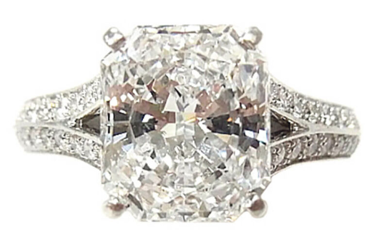 a cushion cut diamond ring set in 18k white gold