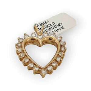a gold heart shaped brooch with clear stones