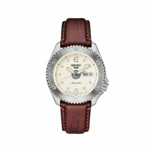 a white watch with brown leather strap