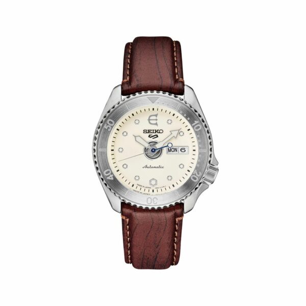 a white watch with brown leather strap