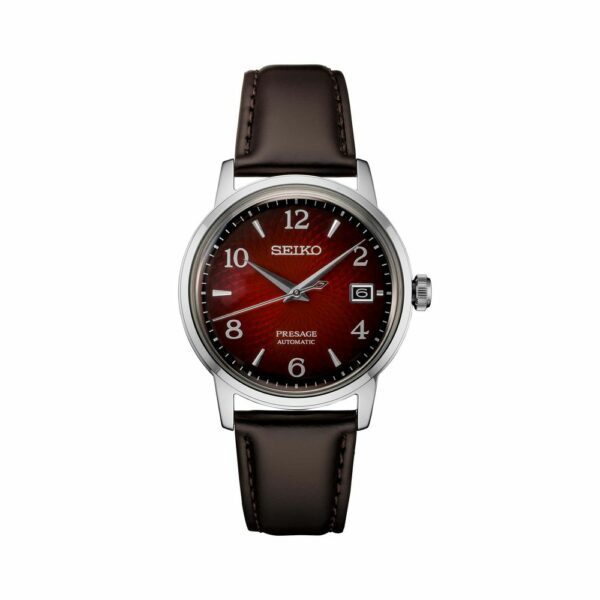 a red and black watch with brown leather straps