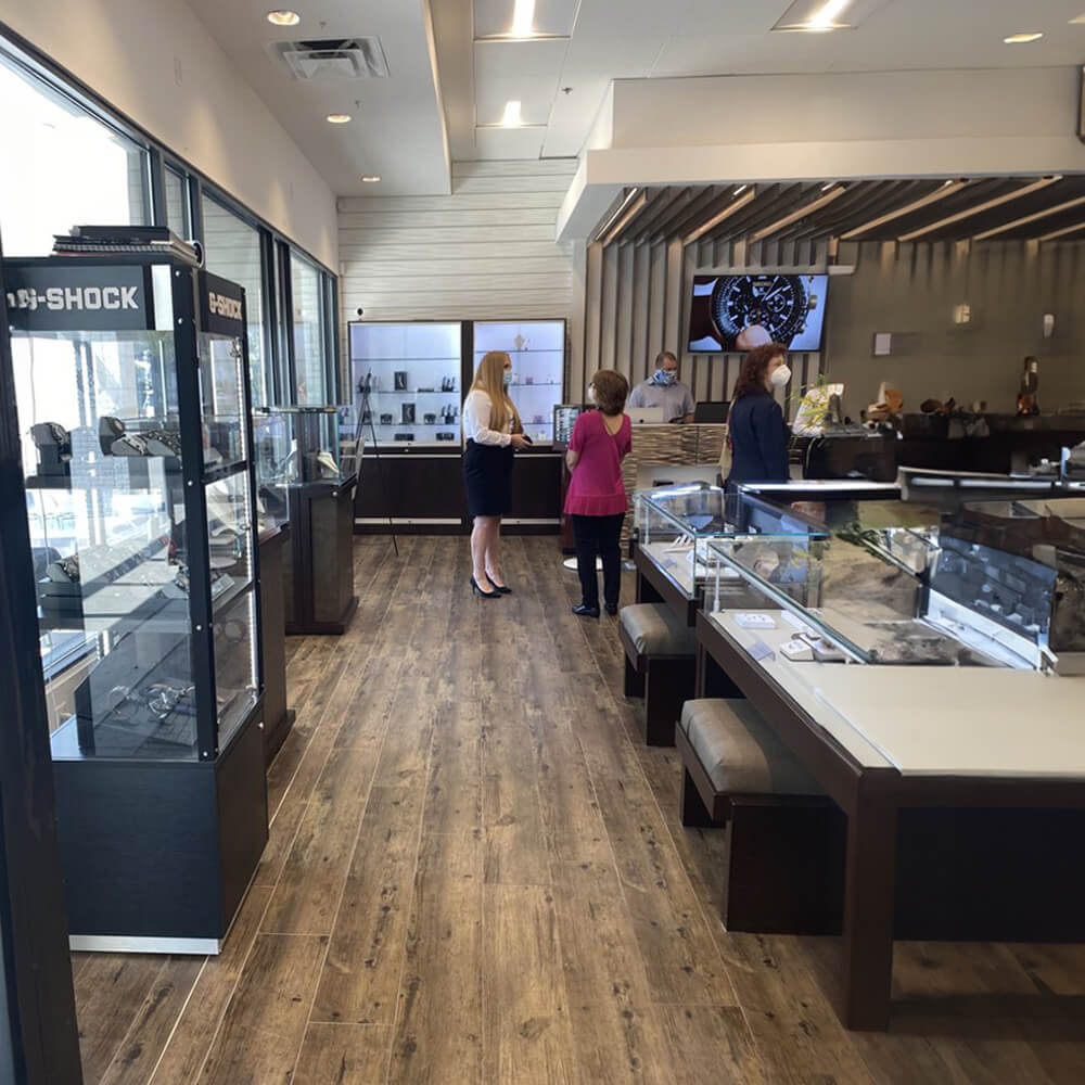 two women looking at jewelry in a store
