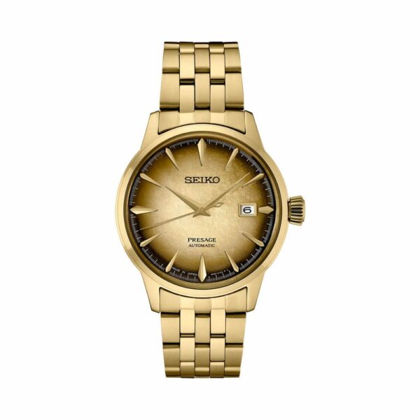 a gold watch with black numbers on the face