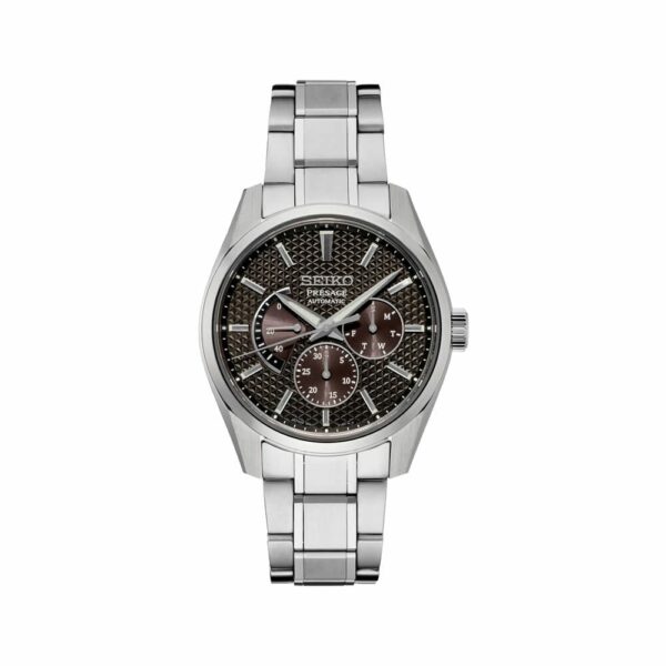 a silver watch with brown dials on a white background