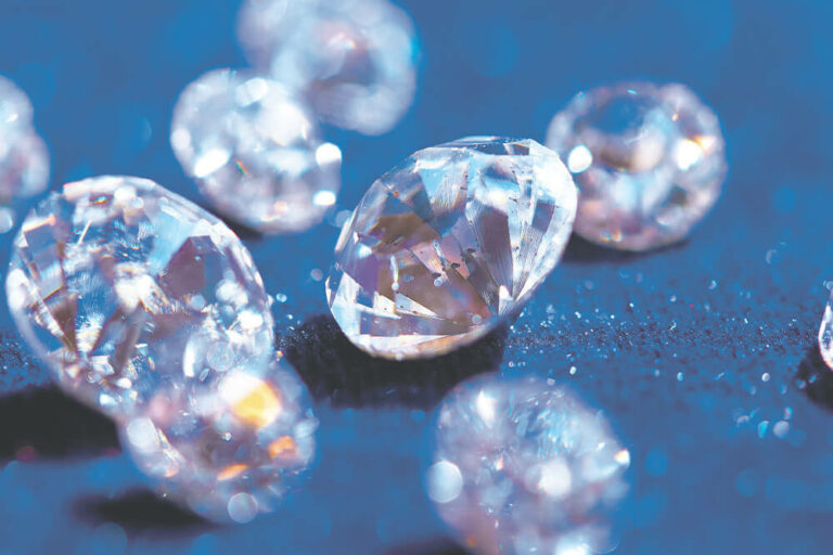 many diamonds are shown on a blue surface