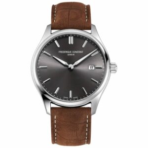 a silver watch with brown leather straps